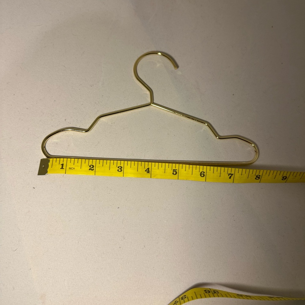 8” Gold Metal Hanger.  For all your pets clothes.